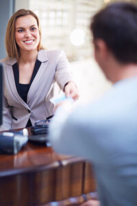 Branch employee smiling after purchase NCR ITM